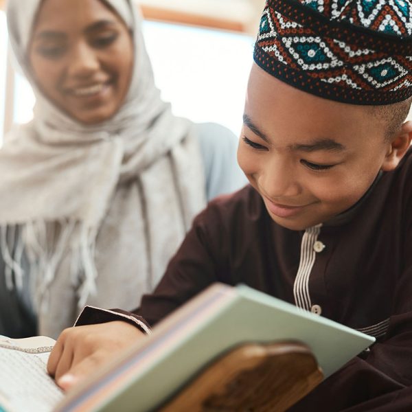 shot-of-a-young-muslim-mother-and-her-son-reading-2022-10-05-04-55-19-utc-copy.jpg